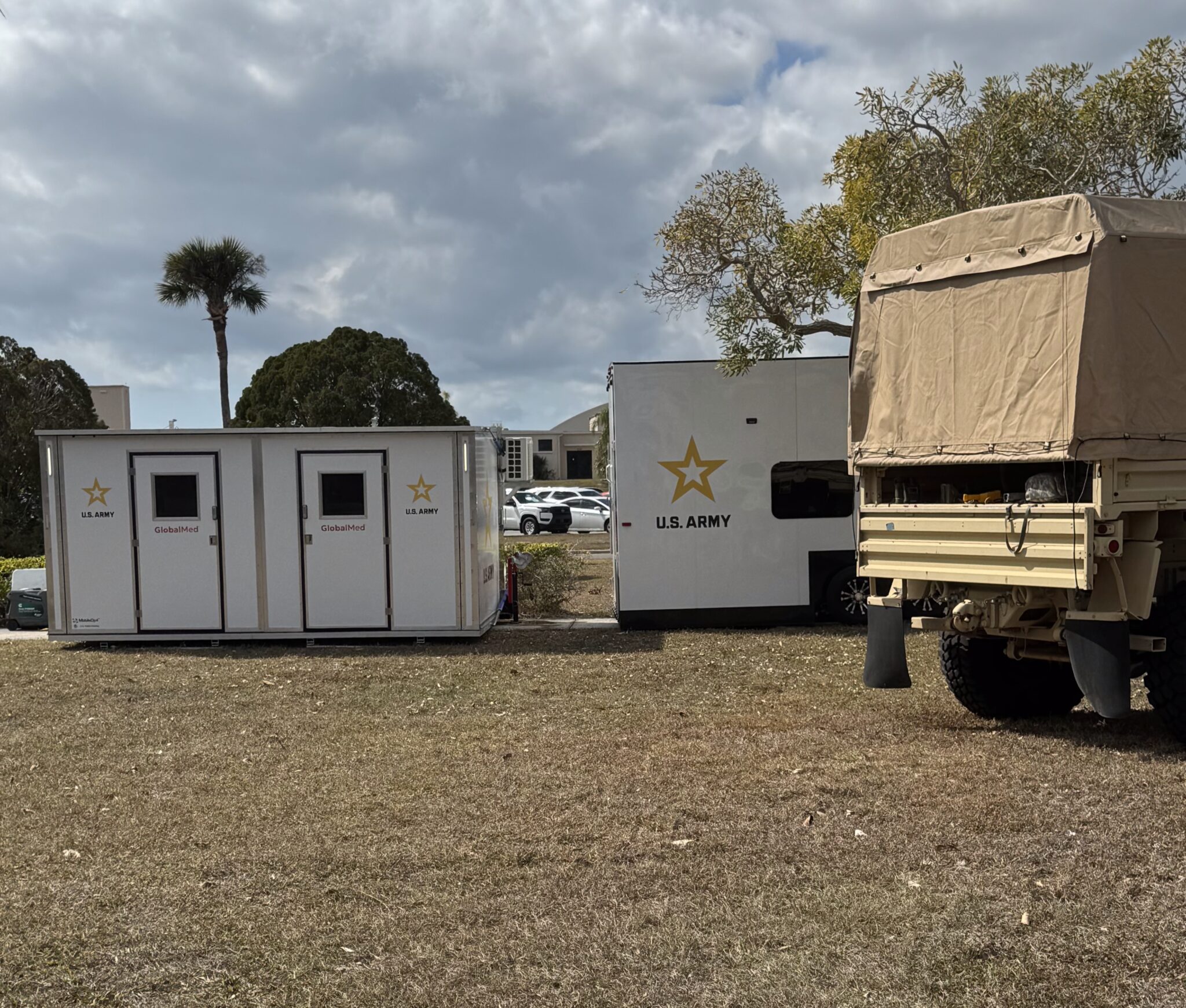 MobileOp4 mobile unit with U.S. Army branding deployed alongside military vehicle